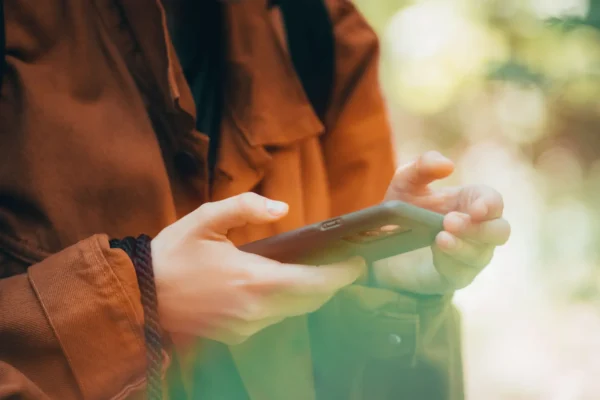 A woman making a date on her phone
