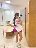 Cork escort posing in the gym lockerroom