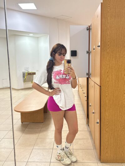 Cork escort posing in the gym lockerroom