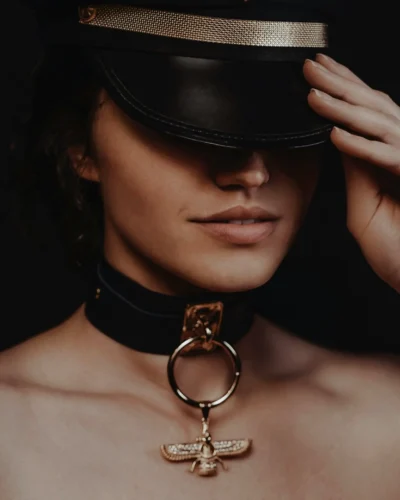 Mistress wearing a military hat
