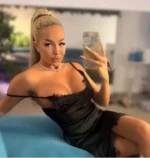 Attractive Dundee escort in a black silky dress