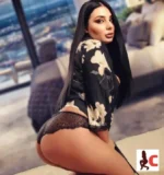 Raven haired escort in black panties