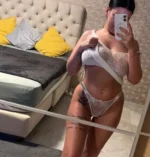 Curvy tattooed Dundee escort in white lingerie