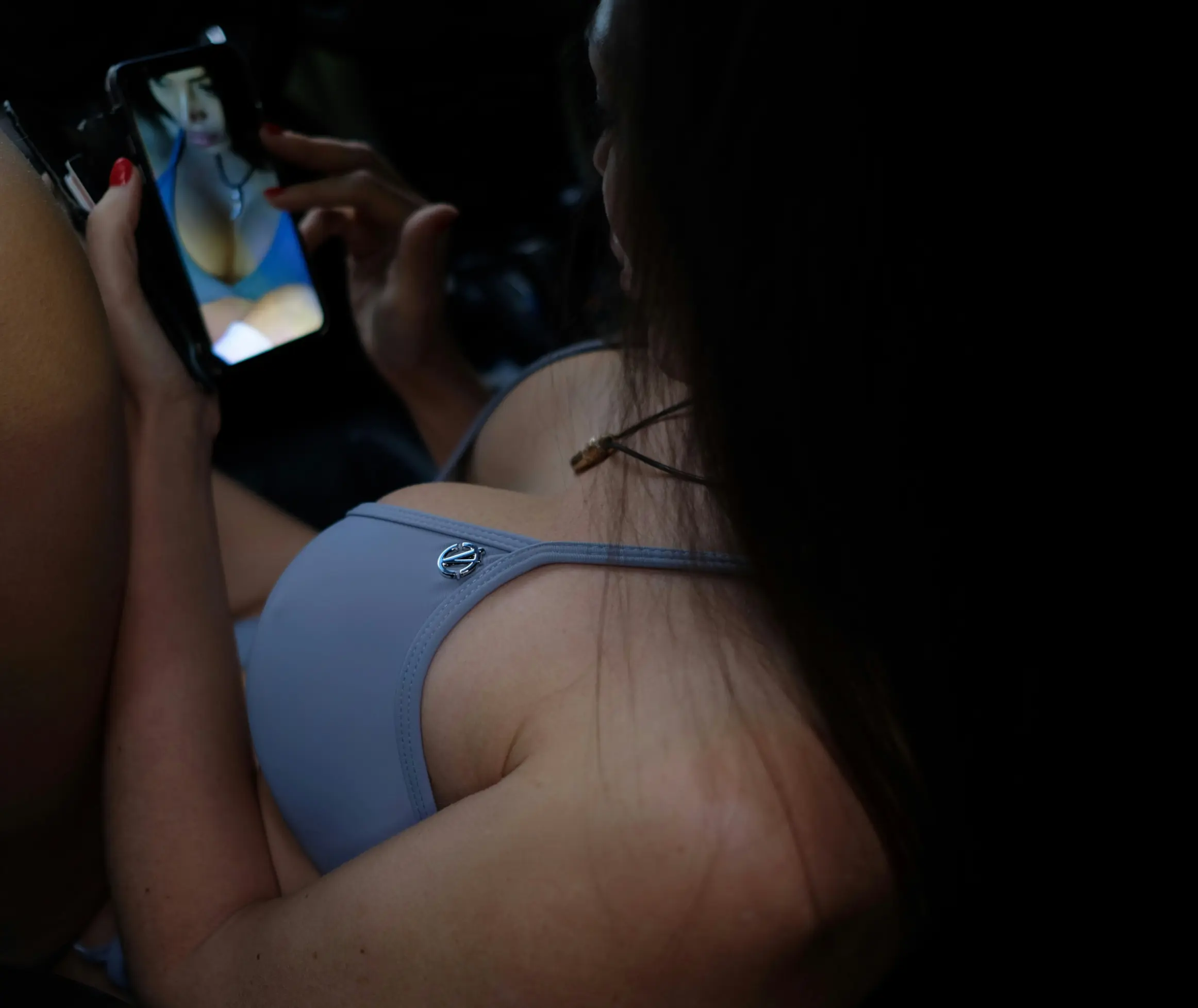 Busty woman using her phone